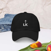 corner cap jnjdjdnbjnddbnksckn featuring embroidered LK logo on a black adjustable cap.